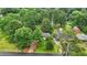 An aerial view of a home and its neighbors with lots of trees at 4188 Fontana Ct, Tucker, GA 30084