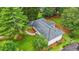 Aerial view of a home showing the roof, lawn, driveway, and surrounding landscape at 4188 Fontana Ct, Tucker, GA 30084