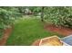 Large backyard and new wooden deck with plenty of green grass and foliage at 4188 Fontana Ct, Tucker, GA 30084