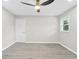 This bedroom offers ample space, light gray walls, wood-look floors, and a ceiling fan for added comfort at 4188 Fontana Ct, Tucker, GA 30084
