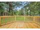 A new wood deck with a view to a grassy backyard at 4188 Fontana Ct, Tucker, GA 30084
