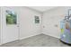Functional laundry area with direct outdoor access, natural light, and ample space for laundry appliances at 4188 Fontana Ct, Tucker, GA 30084