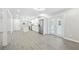 Bright and open-concept living area with white walls, recessed lighting, and modern kitchen at 4188 Fontana Ct, Tucker, GA 30084