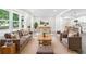 Inviting living room with elegant gray floors, modern furnishings, and seamless connection to the open-concept kitchen at 4188 Fontana Ct, Tucker, GA 30084