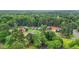 A view of the property in a community surrounded by lush, green trees at 4188 Fontana Ct, Tucker, GA 30084