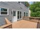 Outdoor deck and backyard with gray siding on home at 1095 Lyndhurst Way, Roswell, GA 30075