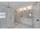 Beautiful bathroom featuring double sinks, modern fixtures, and a glass enclosed shower at 1095 Lyndhurst Way, Roswell, GA 30075