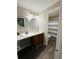 Bathroom featuring dual sinks, vanity with wood cabinetry, and tile flooring at 2107 Augusta Se Dr, Marietta, GA 30067