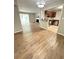 Open living area, connecting the kitchen, dining, and living room with modern wood floors at 2107 Augusta Se Dr, Marietta, GA 30067