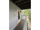 Exterior porch entrance with a welcome mat, white railing, and the unit number 2101 at 2107 Augusta Se Dr, Marietta, GA 30067