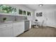 Well-lit kitchen with stainless steel appliances, white cabinetry, and an adjacent dining area at 2991 Catalina Dr, Decatur, GA 30032