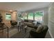Bright living room with large windows overlooking greenery, modern furniture, and stylish decor at 2991 Catalina Dr, Decatur, GA 30032