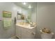 Cozy bathroom featuring a single sink vanity with gold fixtures at 3777 Peachtree Ne Rd # 1112, Brookhaven, GA 30319