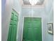 Home entry way featuring a green front door, interior door, and chandelier at 3777 Peachtree Ne Rd # 1112, Brookhaven, GA 30319
