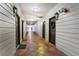 Inviting hallway with beautiful tile flooring and white wood-paneled walls, leading to various unit entrances at 3777 Peachtree Ne Rd # 1112, Brookhaven, GA 30319