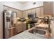 This kitchen boasts stainless steel appliances, light countertops, and ample cabinet space at 3777 Peachtree Ne Rd # 1112, Brookhaven, GA 30319