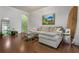Well-lit living room with hardwood floors and neutral decor at 3777 Peachtree Ne Rd # 1112, Brookhaven, GA 30319