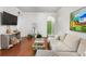 Open-concept living area features hardwood floors and neutral paint at 3777 Peachtree Ne Rd # 1112, Brookhaven, GA 30319