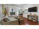 Inviting living room with hardwood floors, neutral decor, and lots of natural light at 3777 Peachtree Ne Rd # 1112, Brookhaven, GA 30319