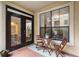 Outdoor patio space with table, chairs, and a view of the building across the way at 3777 Peachtree Ne Rd # 1112, Brookhaven, GA 30319