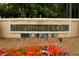 Elegant community sign with floral accents, welcoming residents and guests to Peachtree Place at 3777 Peachtree Ne Rd # 1112, Brookhaven, GA 30319