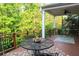 Relax on the spacious back deck with outdoor furniture perfect for entertaining and enjoying green space at 6298 Pierless Ave, Sugar Hill, GA 30518