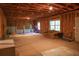 Large unfinished basement offering potential for customization with access to the backyard at 6298 Pierless Ave, Sugar Hill, GA 30518