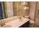 Bright bathroom boasts dual sinks, ample counter space, and a shower/tub combo at 6298 Pierless Ave, Sugar Hill, GA 30518