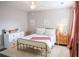 Cozy bedroom with a double bed, soft rug, and neutral-toned walls and decor at 6298 Pierless Ave, Sugar Hill, GA 30518