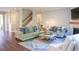Spacious living room with a cozy fireplace, comfortable seating, and a stylish area rug at 6298 Pierless Ave, Sugar Hill, GA 30518