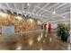 Spacious common area featuring a textured wood wall, seating, and ample open space for residents to enjoy at 878 Peachtree St # 601, Atlanta, GA 30309