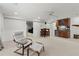 Finished basement offers a bar area with wooden cabinets, mini fridge, and a cozy seating area at 2015 Samuel Close Ct, Alpharetta, GA 30009
