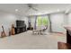 Finished basement area showcasing carpet floors, neutral walls, and a lounge area at 2015 Samuel Close Ct, Alpharetta, GA 30009