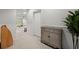 Finished basement area showcasing neutral walls, shelving, and a tiled floor at 2015 Samuel Close Ct, Alpharetta, GA 30009