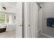 Bright bathroom featuring a tiled shower with curtain and neutral wall color at 2015 Samuel Close Ct, Alpharetta, GA 30009
