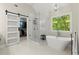 This bathroom features a stand alone tub, large shower, and custom closet at 2015 Samuel Close Ct, Alpharetta, GA 30009