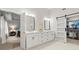 Bathroom featuring a vanity, custom closet and doorway leading to bedroom at 2015 Samuel Close Ct, Alpharetta, GA 30009
