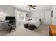 Well-lit bedroom featuring a ceiling fan, neutral walls, and a bright window at 2015 Samuel Close Ct, Alpharetta, GA 30009