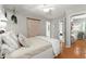 Comfortable bedroom with closet and view of adjacent bathroom at 2015 Samuel Close Ct, Alpharetta, GA 30009