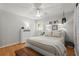 Cozy bedroom with wood floors, a ceiling fan, and bright decor at 2015 Samuel Close Ct, Alpharetta, GA 30009