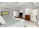 Bright bedroom features tray ceilings and doorways leading to other rooms at 2015 Samuel Close Ct, Alpharetta, GA 30009