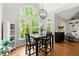 Dining area with large windows that floods the space with light and provides beautiful views of the yard at 2015 Samuel Close Ct, Alpharetta, GA 30009