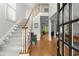 Welcoming foyer with hardwood floors, staircase, and view into the living spaces at 2015 Samuel Close Ct, Alpharetta, GA 30009
