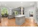 Open kitchen with hardwood floors, modern appliances, and a large island, great for entertaining and easy living at 2015 Samuel Close Ct, Alpharetta, GA 30009