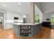 Modern kitchen with white and gray cabinets, hardwood floors, stainless appliances, and lots of counter space at 2015 Samuel Close Ct, Alpharetta, GA 30009