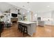 Open-concept kitchen featuring a large island and seamless flow into the living area at 2015 Samuel Close Ct, Alpharetta, GA 30009