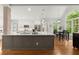 Bright kitchen featuring a large island with white countertops and stainless steel appliances at 2015 Samuel Close Ct, Alpharetta, GA 30009