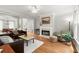 Bright living room offers hardwood floors, fireplace, and comfortable seating, perfect for relaxing or entertaining guests at 2015 Samuel Close Ct, Alpharetta, GA 30009