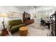 Living room featuring a cozy sitting area, hardwood floors, and a bright window at 2015 Samuel Close Ct, Alpharetta, GA 30009