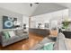 Open concept living space featuring seamless connection to kitchen and an abundance of natural light at 2015 Samuel Close Ct, Alpharetta, GA 30009